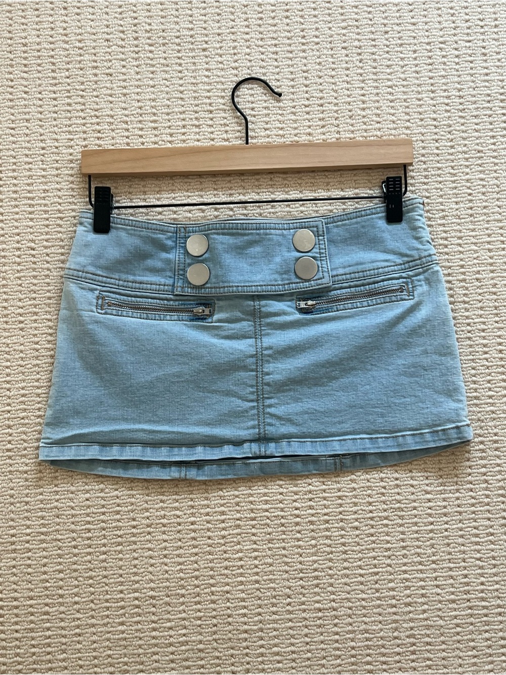 UO Light Wash Denim Low Waisted Mini Skirt with Silver Button Detail
